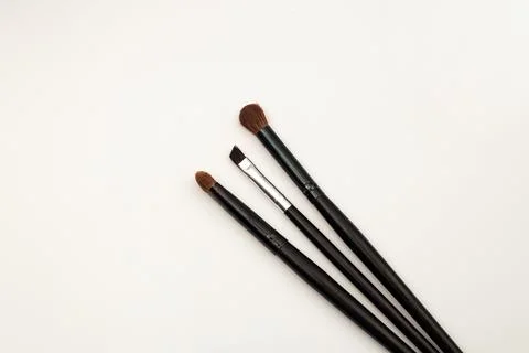 Makeup brushes on white background, template frame Stock Photos