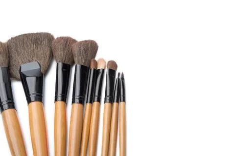 Makeup brushes on white isolated background for female beauty. Stock Photos