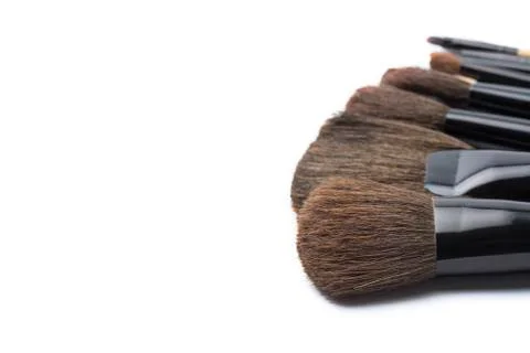 Makeup brushes on white isolated background for female beauty. Stock Photos