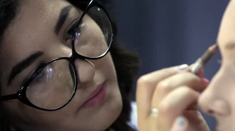 Makeup. Cosmetics. Makeup artist at work Stock Footage 67318618