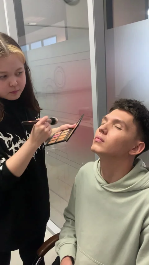 Makeup expert smooths face with delicate layers of powder Stock Footage 313865856