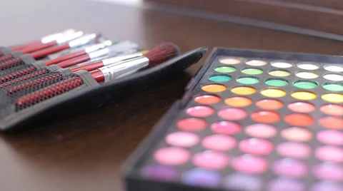 Makeup eye shadow palette in many different colors, brush brushing. Stock Footage 66002330