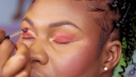 Makeup on eyes. make up artist applying make up	 Stock Footage 239589031