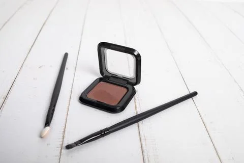 Makeup items. brown eye shadow. Stock Photos