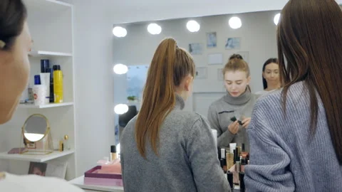 Makeup lesson. The master tells the student about makeup. Master class for Stock Footage 166921265