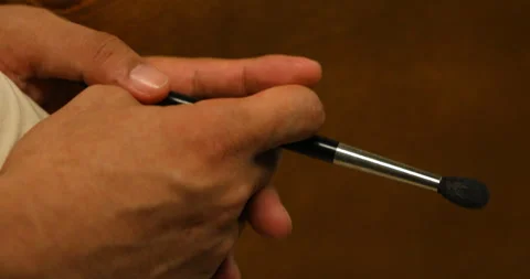 Makeup man holding a brush in a hand Stock Footage 293180623