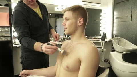 Makeup master making art makeup for a man Stock Footage 73518390
