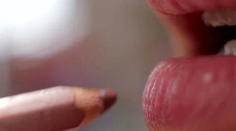 Makeup with pen on lips macro Stock Footage 59732077