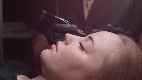 Makeup permanent on  the eyebrows of a young girl Video stock 166625059