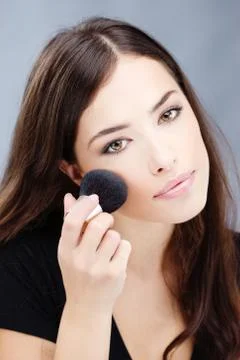 Makeup with powder brush Stock Photos