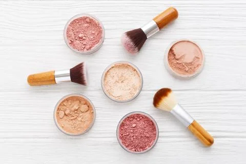 Makeup powder with brushes flat lay Stock Photos
