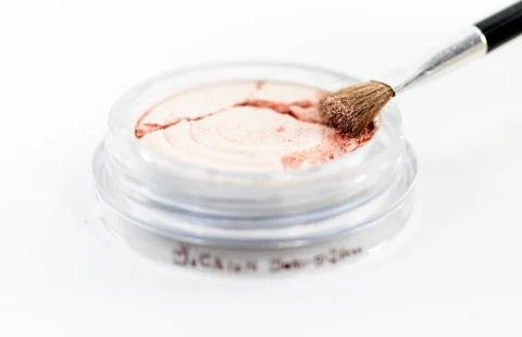 Makeup powder in sphere box on white background Stock Photos