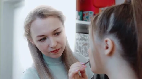 Makeup process. Make-up artist in the studio carefully makes up for the Stock Footage 149269881