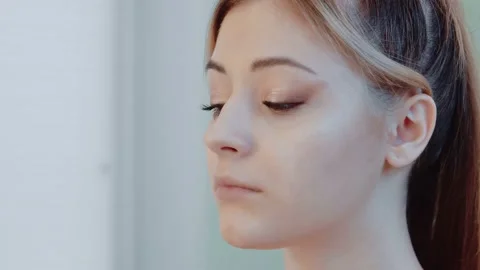 Makeup process. Makeup artist in the studio makes makeup for the beauty Stock Footage 149269750