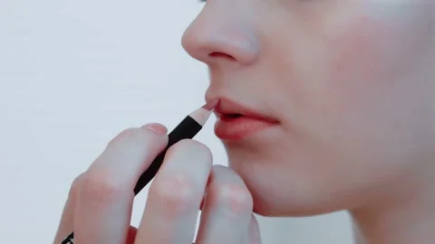 Makeup process. Makeup artist in the studio makes makeup for the beauty Stock Footage 149269799