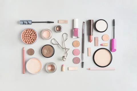 Makeup products arranged rectangular shape white backdrop High resolution photo Stock Photos