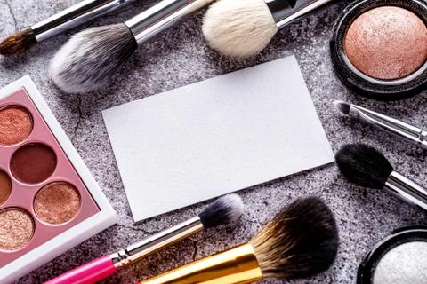 Makeup products for smooth complexion. Blank page notepad and different cosme Stock Photos