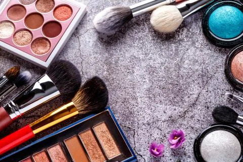 Makeup products for smooth complexion. Blank page notepad and different cosme Stock Photos