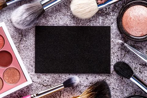 Makeup products for smooth complexion. Blank page notepad and different cosme Stock Photos