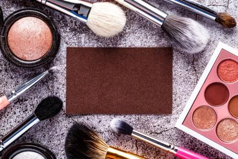 Makeup products for smooth complexion. Blank page notepad and different cosme Stock Photos