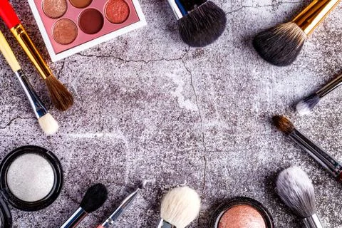 Makeup products for smooth complexion. Blank page notepad and different cosme Stock Photos