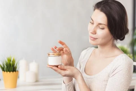 Makeup remove skin care. Closeup woman holding cotton swab and makeup remover Stock-Fotos
