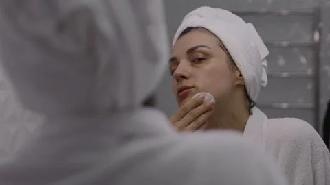 Makeup removing, with cleaning lotion and cotton pads Stock Footage 243198742