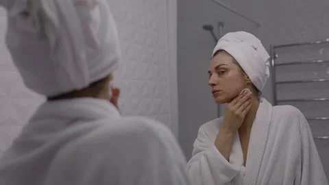 Makeup removing, with cleaning lotion and cotton pads Stock Footage 243198774