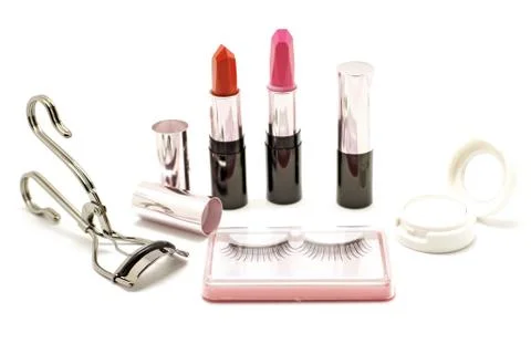 Makeup set with lipstick false lashes eyelash curler and  eyeshadow isolated Stock Photos