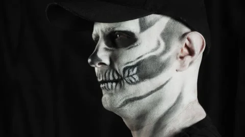 Makeup skeleton for Halloween. A man skeleton in the dim light of a candle. Vídeos de archivo 134858916