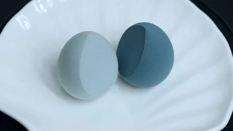 Makeup sponges on a white background rotate Stock Footage 127504087