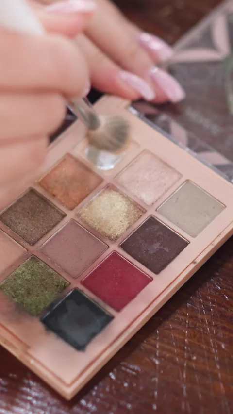 Makeup test demonstration, Studio scene with glittery eye makeup testing process Stock Footage 326671400