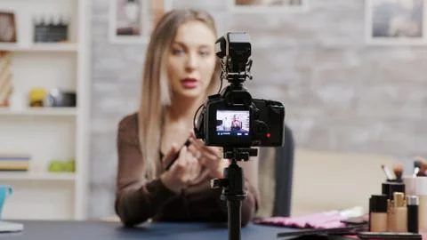 Makeup vlogger recording cosmetics tutorial for subscribers 스톡 사진