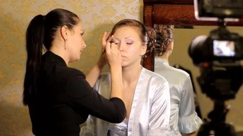 Makeup on wedding мaster doing makeup young woman Stock Footage 43762547