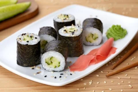 Maki sushi roll with cucumber, wasabi, ginger and nori seaweed Stock Photos
