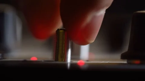 Making adjustments on the amplifier Stock Footage 101575099