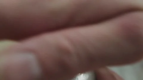 Making alcoholic cocktail. The bartender removes the lid from the shaker Stock-Footage 134035053