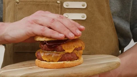 Making American fat smash burger with fresh tomatoes and cheese on grill close Stock Footage 270019664