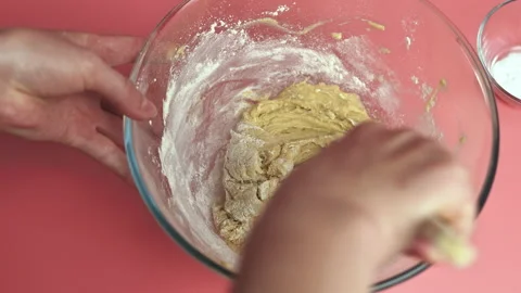 Making and mixing Chocolate Chip Cookies dough in a glass bowl in 4k. Stock Footage 135698364