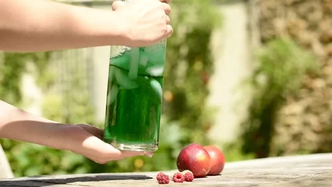 Making and mixing refreshing lemonade on a hot summer Stock-Footage 314913827