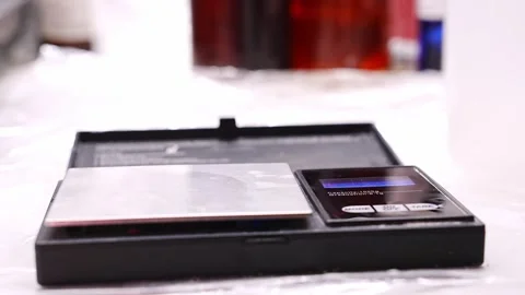 Making aroma diffusers with alcohol and aromatic oils using a jewelry scale Video stock 304499396