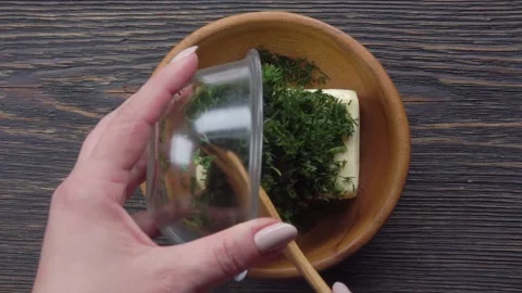 Making Aromatic Herb Butter with Fresh Dill. Top View Stock Footage 314625297