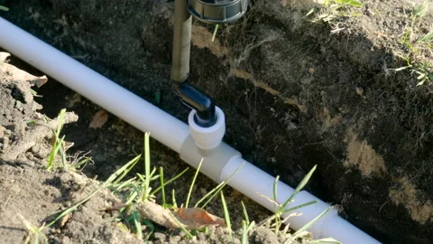 Making of automatic system for watering plants and lawn in the garden. 4K 库存影片 106941342