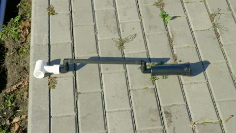 Making of automatic system for watering plants and lawn in the garden. 4K 库存影片 106941551