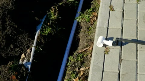 Making of automatic system for watering plants and lawn in the garden. 4K Vidéo 106941667