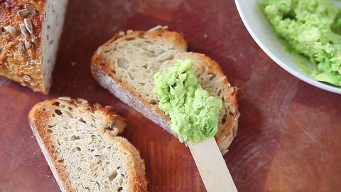 Making avocado toast on artisan bread Stock Footage 81747771
