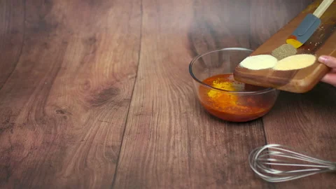 Making barbecue sauce by adding different ingredients, spices in a bowl in 4K Stock Footage 135990993