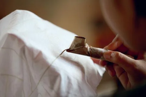 Making batik process. application of wax on fabric Photos