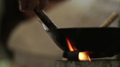 Making batik with tjanting and hot wax Stock Footage 11497854