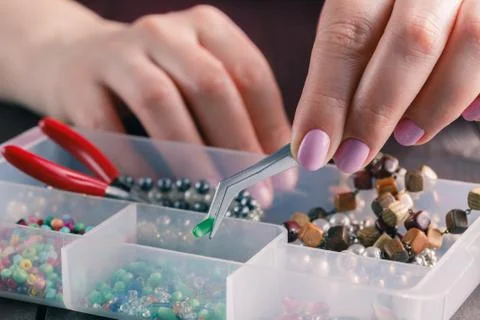 Making a beads necklace Stock Photos